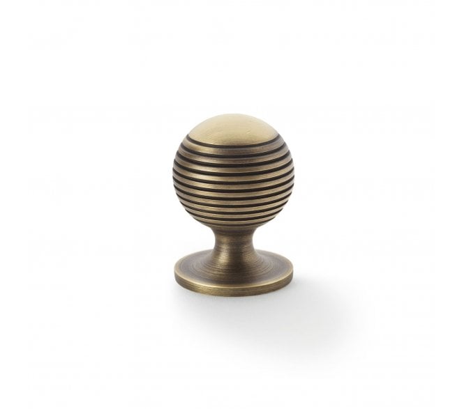 A&W AW832 Caesar Cupboard Knobs On Round Rose - Antique Brass