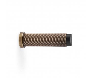 A&W Brunel Knurled Skirting Doorstop 76mm - Antique Brass