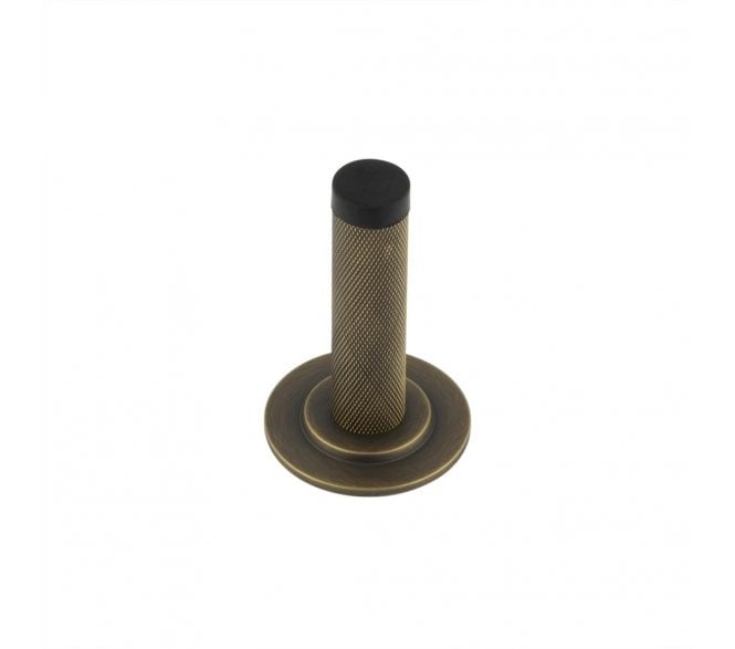 Burlington Knurled Wall Mounted Door Stop On Stepped Rose - Antique Brass