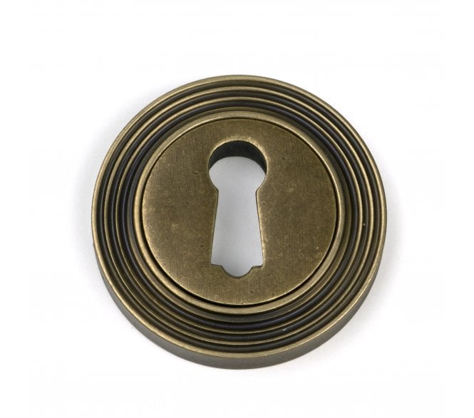 From The Anvil 52445 Standard Keyhole Escutcheon (Beehive) - Burnished Brass
