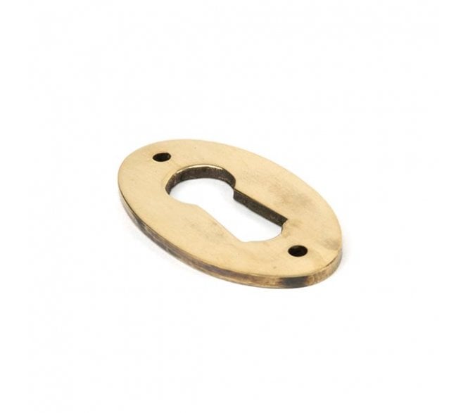 From The Anvil 83818 Period Oval Keyhole Escutcheon - Aged Brass