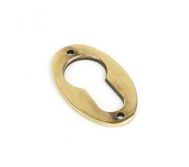 From The Anvil 83819 Oval Euro Profile Escutcheon - Aged Brass