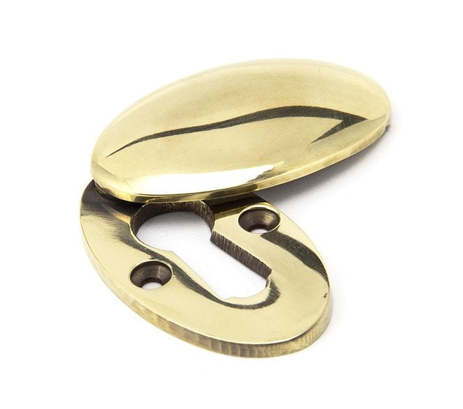 From The Anvil 91988 Period Oval Covered Standard Keyhole Escutcheon - Aged Brass