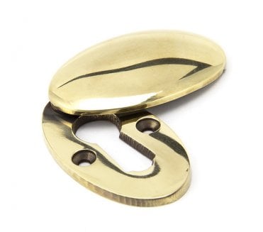 From The Anvil 91988 Period Oval Covered Standard Keyhole Escutcheon - Aged Brass