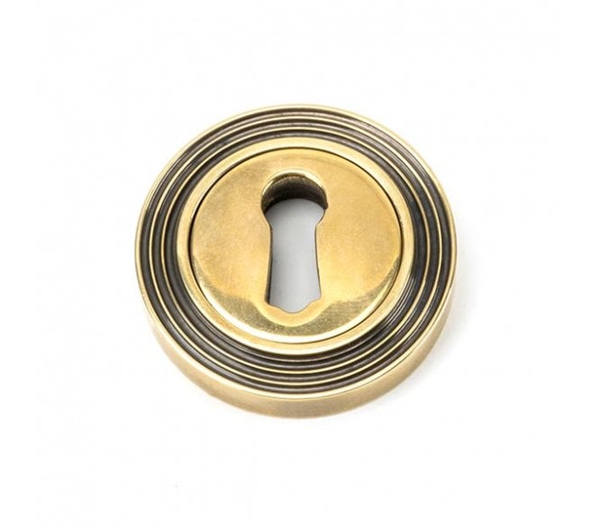 From The Anvil Aged Brass Round Escutcheon (Beehive)