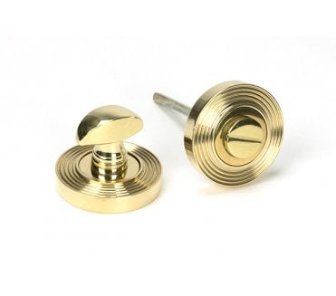 From The Anvil Polished Brass Round Thumbturn Set (Beehive)