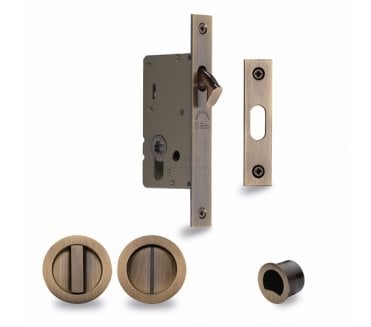 Heritage Brass Round Sliding Pocket Door Bathroom Lock Set - Antique Brass