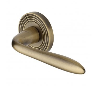 Heritage Brass RR1752 Sutton Lever on Reeded Rose - Antique Brass