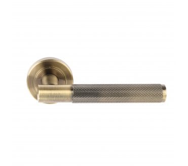 Hunta Evo Knurled Lever On Round Rose - Antique Brass