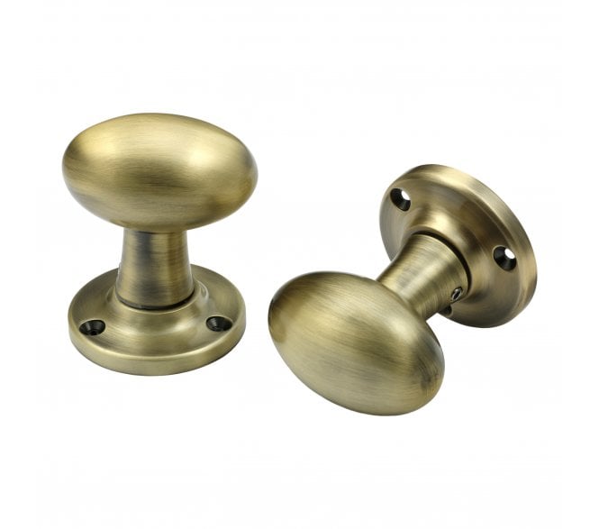 Prima Oval Mortice Knobs - Antique Brass