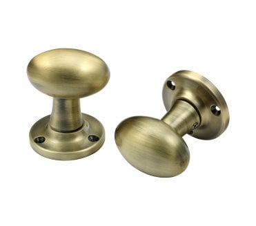 Prima Oval Mortice Knobs - Antique Brass