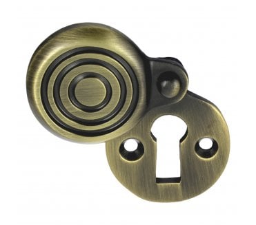 Prima Reeded Covered Standard KeyholeEscutcheon - Antique Brass